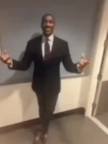 suit-slideshow-man-in-suit-sitting.gif