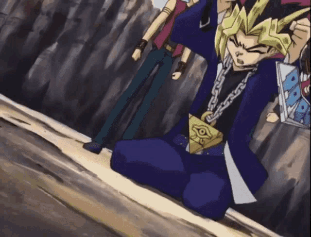 a man in a blue suit is kneeling down with a chain around his waist that says ' yu gi oh ' on it